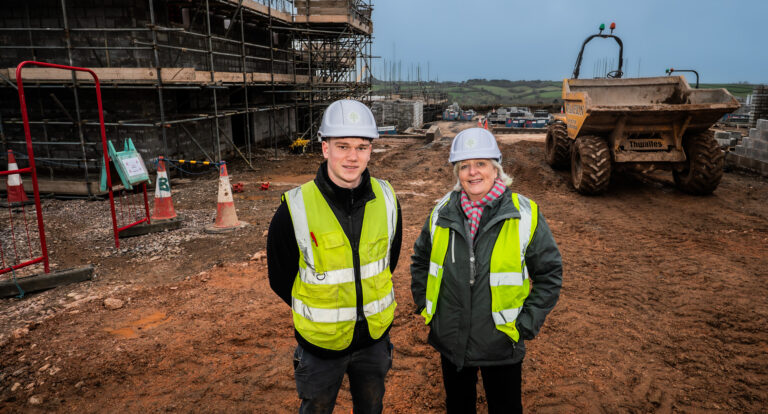 MP visits Dartmouth housing scheme backing 416 new homes