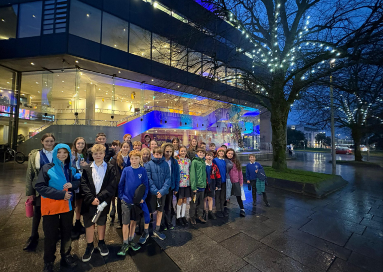 Schoolchildren captivated by Lion, Witch and Wardrobe
